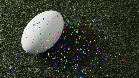 animation of confetti over white rugby ball on grass