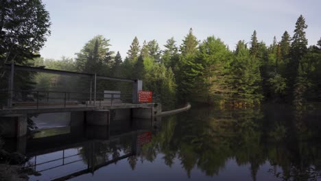 Beautiful-Sunrise-Nature-Landscape-In-Algonquin-Park,-Lake-Dam-And-Reflections