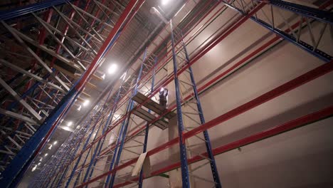 big and modern warehouse under construction, featuring metal shelving and other industrial equipment.