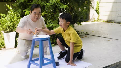 asian man and boy in the backyard