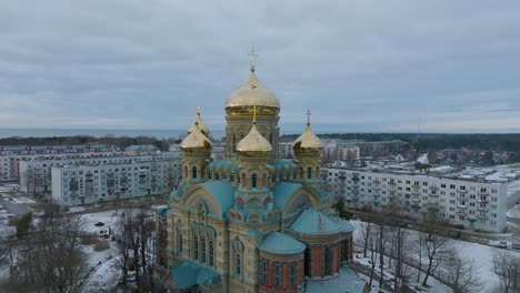 aerial establishing view of orthodox , ascending wide orbiting drone shot