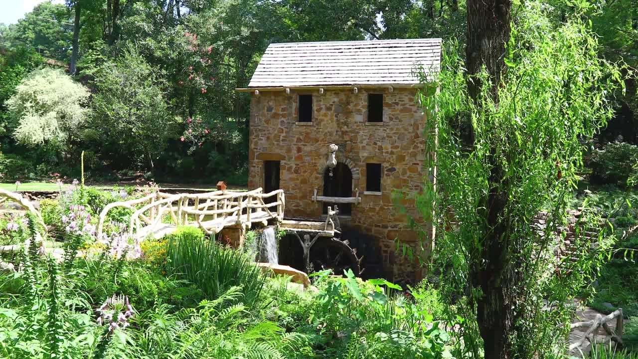 Static video of the Old Mill in Little Rock Arkansas. Medium shot showing building and waterwhell