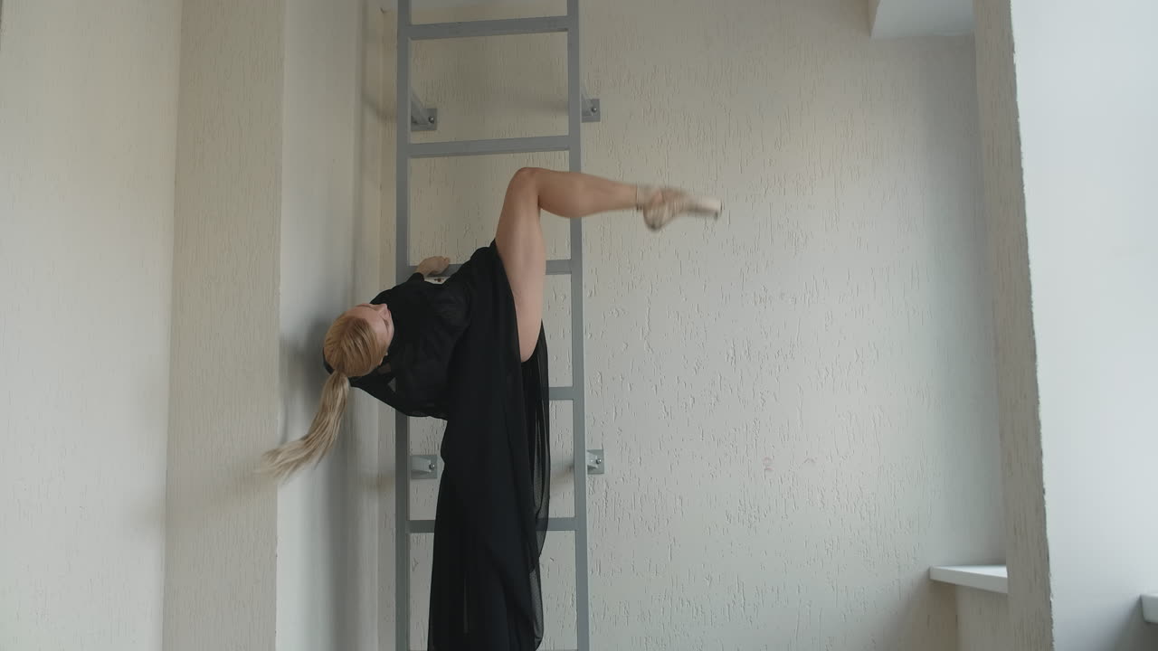 Ballet Dancer Stretching on a Metal Ladder
