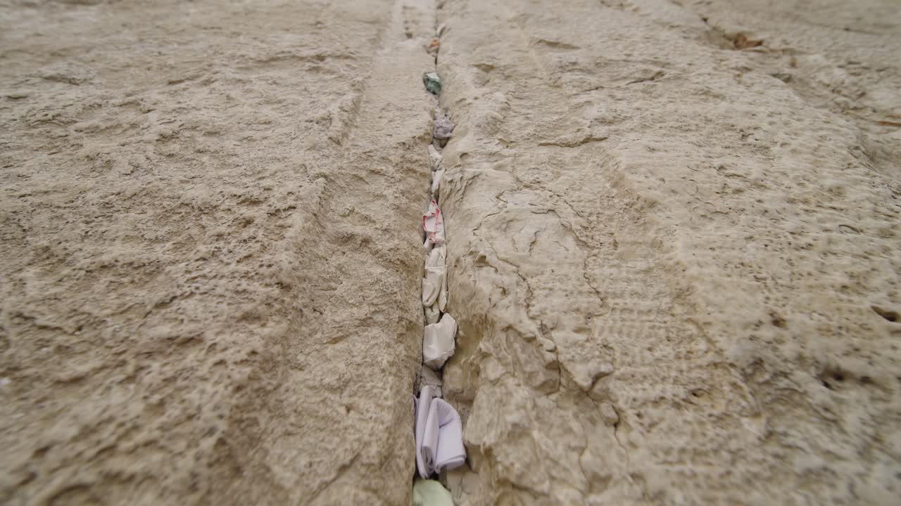 Close-Up of Prayer Notes Inserted in the Cracks of the Western Wall in Jerusalem