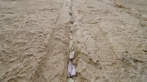 close-up of prayer notes inserted in the cracks of the western wall in jerusalem