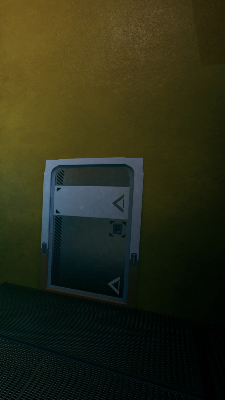 Metallic door with geometric designs on a bright yellow wall