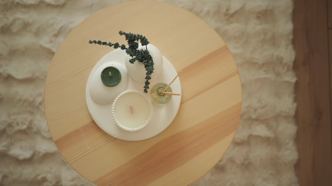 Aesthetic Home Decor with Candles, Lavender, and Diffuser on a Wooden Table