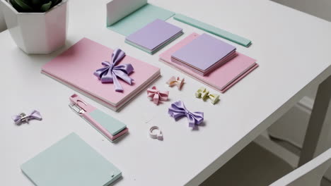 pastel craft supplies and stationery on a white table