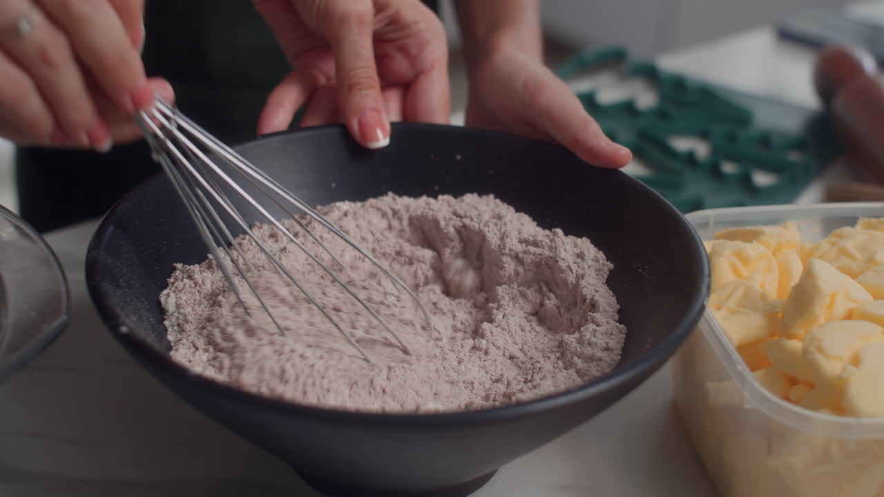Hands of People Whisking Flour for Dough in Bowl