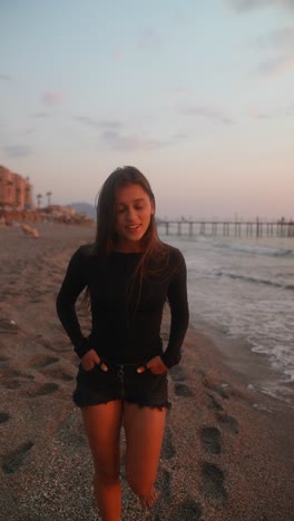 woman on a beach at sunset