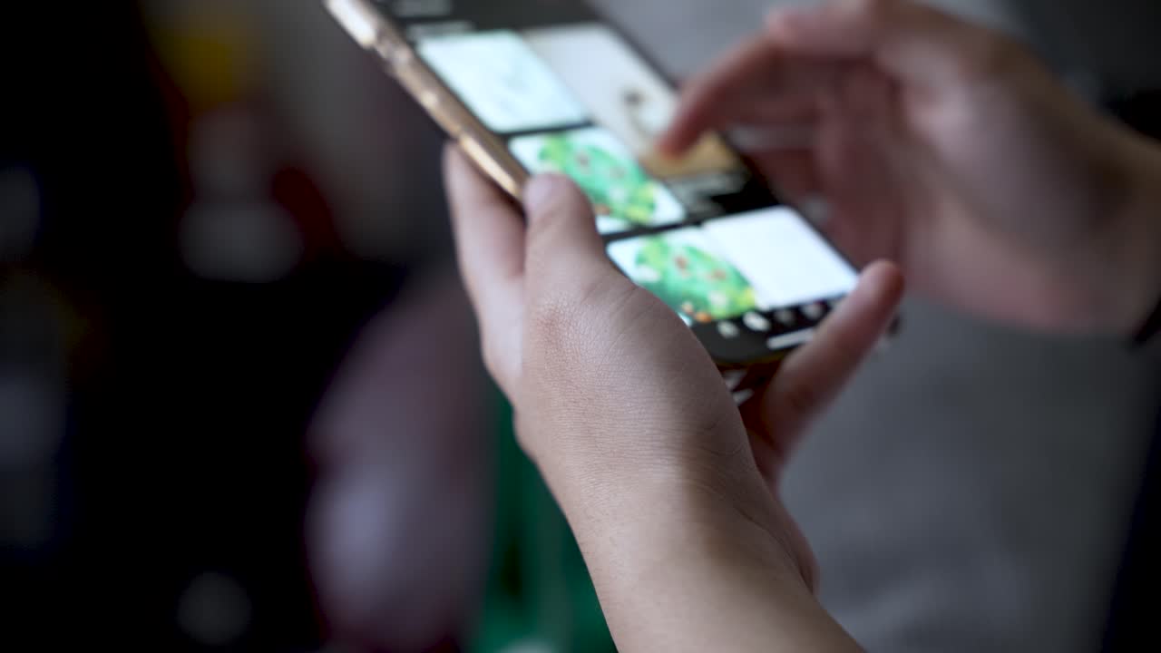 Close up of hands actively browsing a social media app on a smartphone, capturing the essence of digital communication and connection