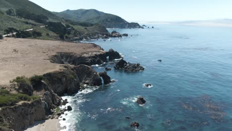 down tilt of rocky shore of the pacific ocean near notleys landing viewpoint close to highway 1 in california,usa