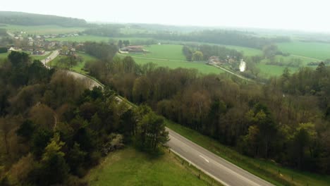 aerial shot of the road in the farm