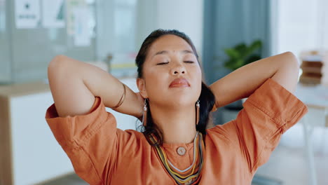 asian woman stretching at desk for relax