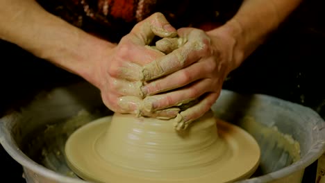 3 shots. professional male potter working in workshop