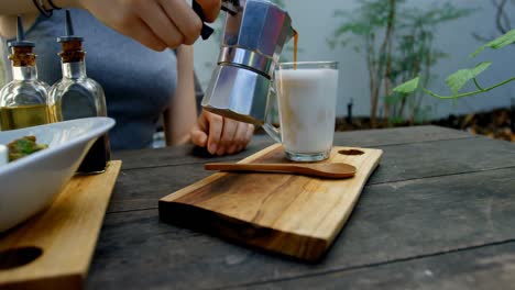 Woman-preparing-coffee-on-the-table-4k