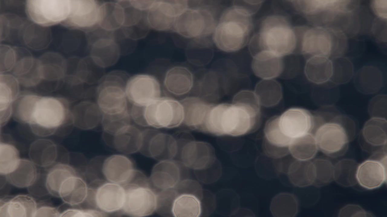 Abstrakt havglimmer, lyskugler, bokeh i slowmotion