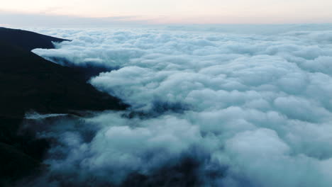 high altitude flight above fluffy cumulonimbus clouds, bica da cana, madeira