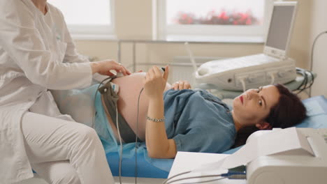 pregnant woman undergoing ultrasound scan