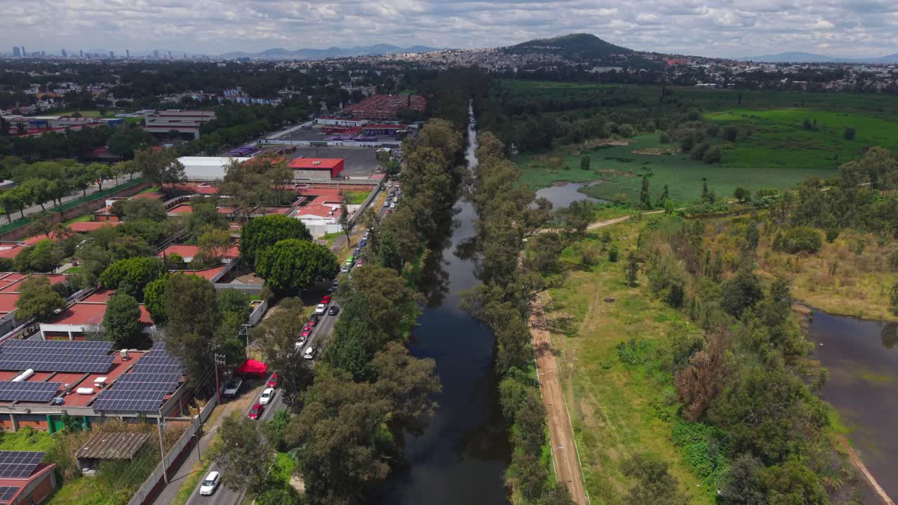 Aerial shot of Xochimilco wetlands bordering CDMX streets, highlighting its ecological reserve zones