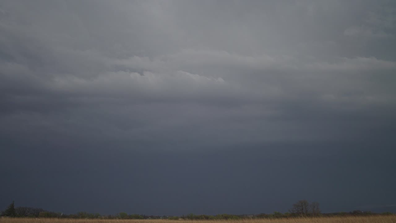 Lightning Flashing Through The Dark Clouds Before The Rainstorm. - wide shot