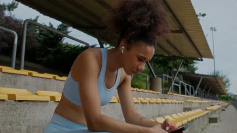 woman resting at the stadium