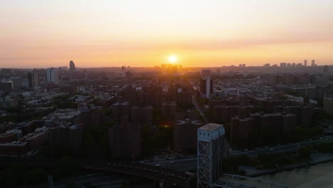 aerial tracking shot of the harlem cityscape, sunny evening in manhattan, new york