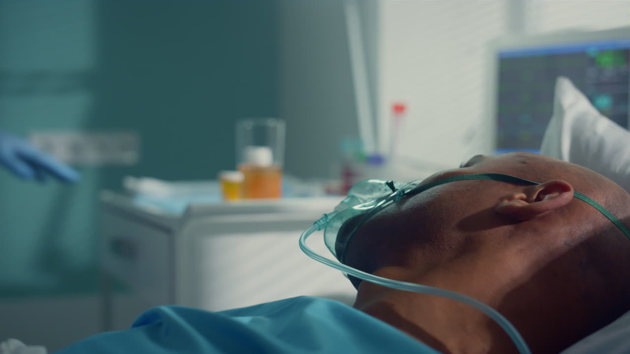 Doctor take tubes covid19 for clinic test. Patient lie in oxygen mask closeup