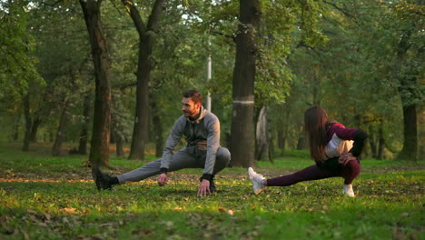 couple stretching in the park