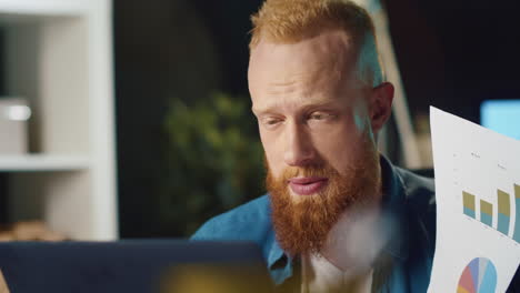 Closeup-angry-businessman-making-video-call-on-laptop-computer-at-home-office