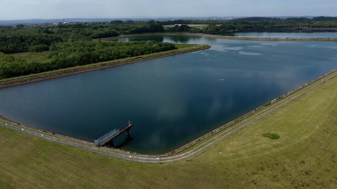 Water supply reservoir sewage contamination social issues aerial view rising over rural lake