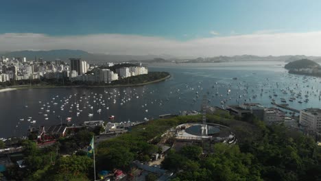 the new holocaust museum under construction on the pasmado hill in the city of rio de janeiro with in the background the pleasure boat cove and wider guanabara bay at sunrise
