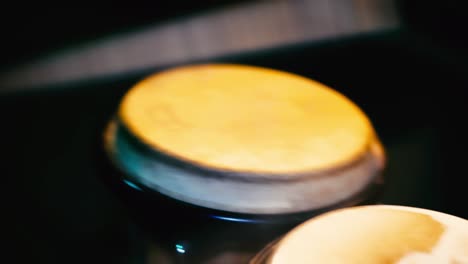 Close-up-of-Bongo-drums-being-played-using-drum-sticks