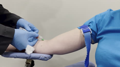 capture of a woman having her blood drawn for testing