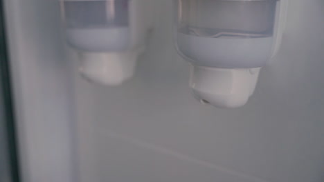 detail of hand soap falling from dispenser