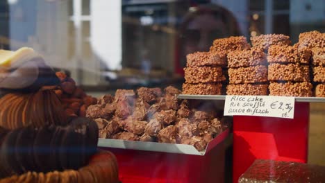 assortment of delicious chocolate truffles and rice cakes at a confectionery