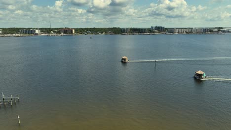 Aerial-view-of-2-floating-Tiki-Bars-in-Orange-Beach,-Alabama