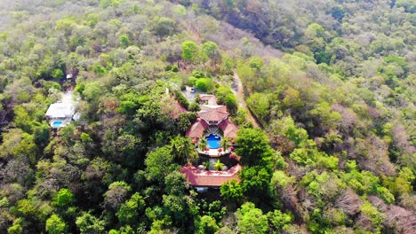 slow wide aerial drone shot of los altos de eros a luxury resort and spa in costa rica