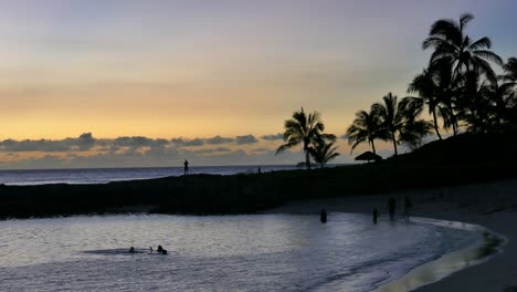 sunset beach scene with people