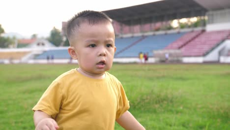 cute asian little boy running