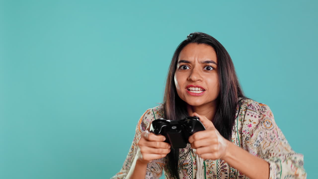 Upset woman showing thumbs down sign gesturing holding controller