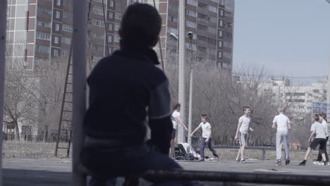 children playing basketball outdoors