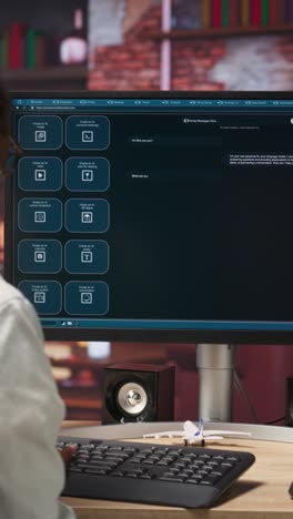 Vertical video Woman seated at desk using AI LLM chatbot software in modern urban home office