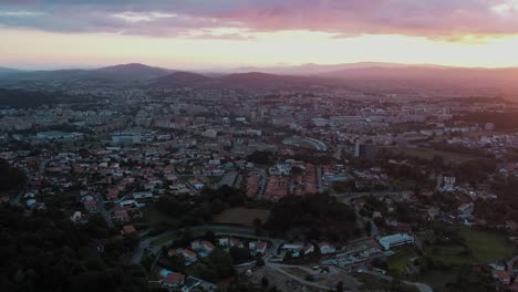 Sunset-view-over-Braga-cityscape-with-mountains-in-the-distance,-Portugal