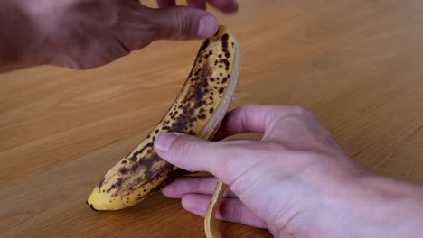 rotten brown bio fruit banana in close up which is a bad waste of food