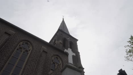 footage of a cross in front of a church in germany