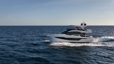 Slow-motion-shot-of-luxury-yacht-making-waves-at-sea