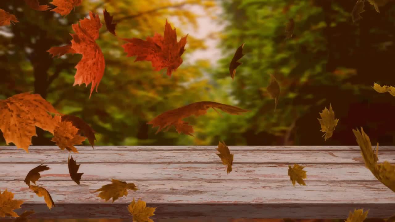 animación digital de múltiples hojas de otoño flotando sobre la superficie de madera contra el bosque