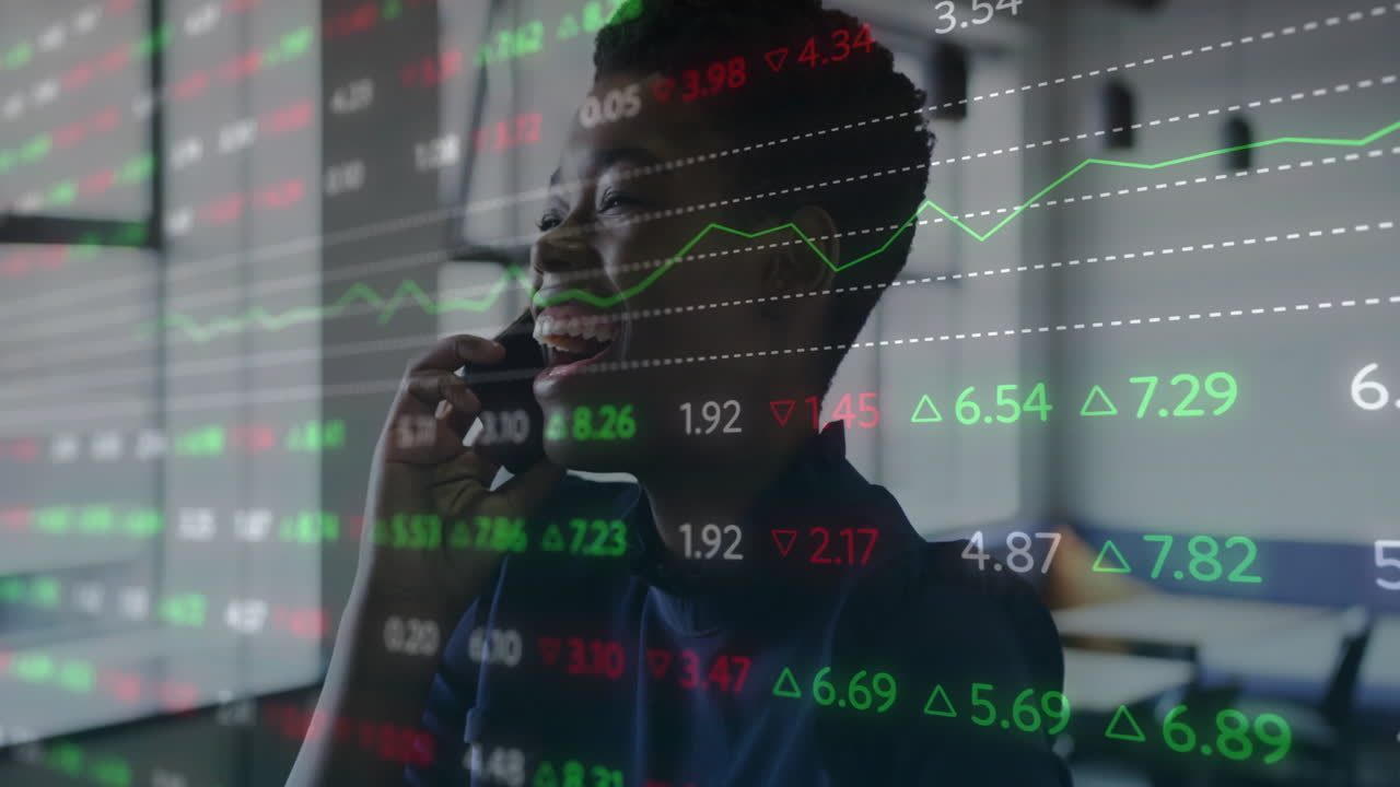 Animation of diagrams and data processing over biracial businesswoman talking on smartphone