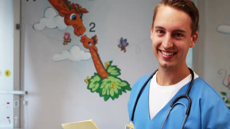 smiling doctor holding medical report in hospital